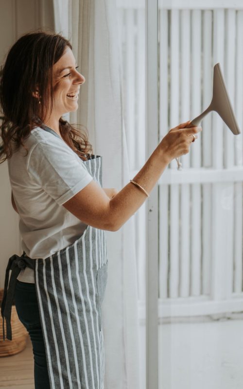 staff cleaning windows